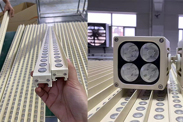 A close-up of custom-colored LED wall washer fixtures on a production line